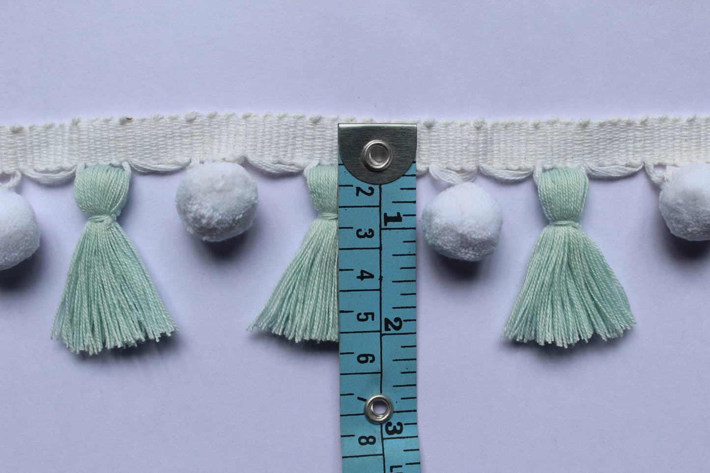 baby blue / white pom pom tassel