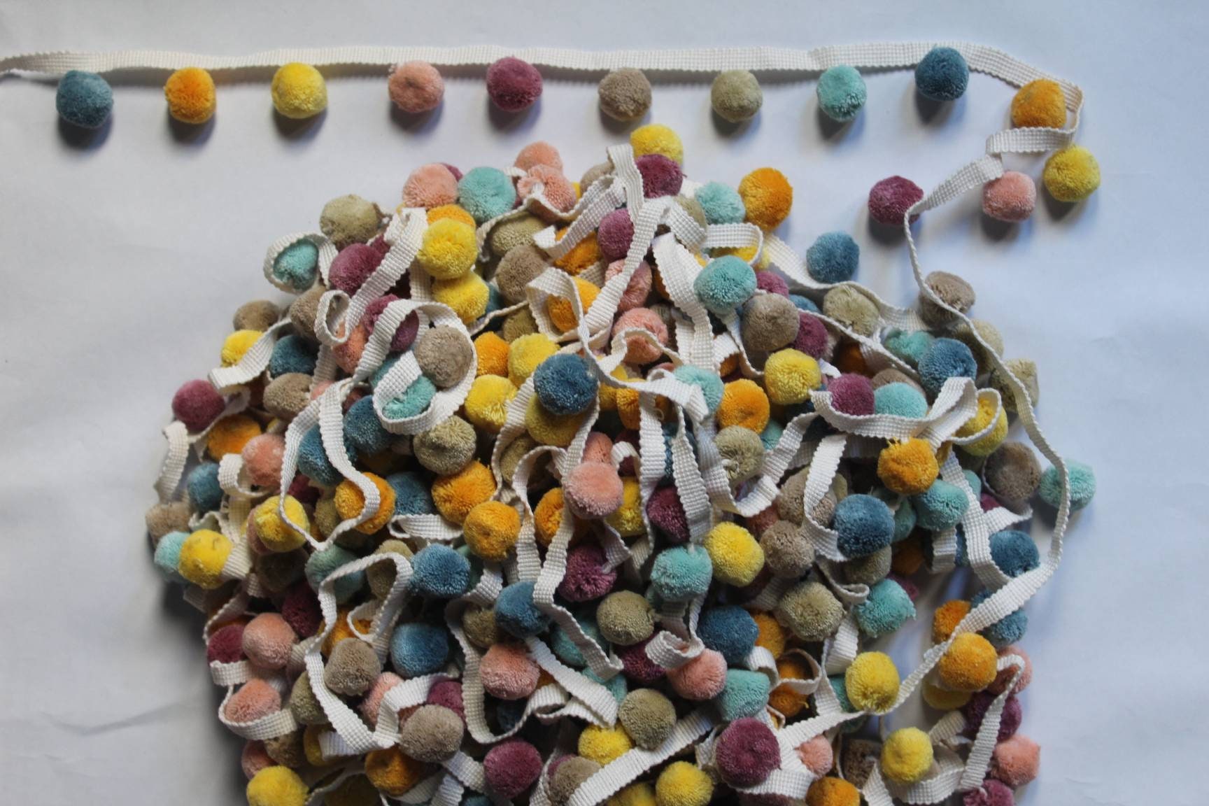 multi colored pom pom trim