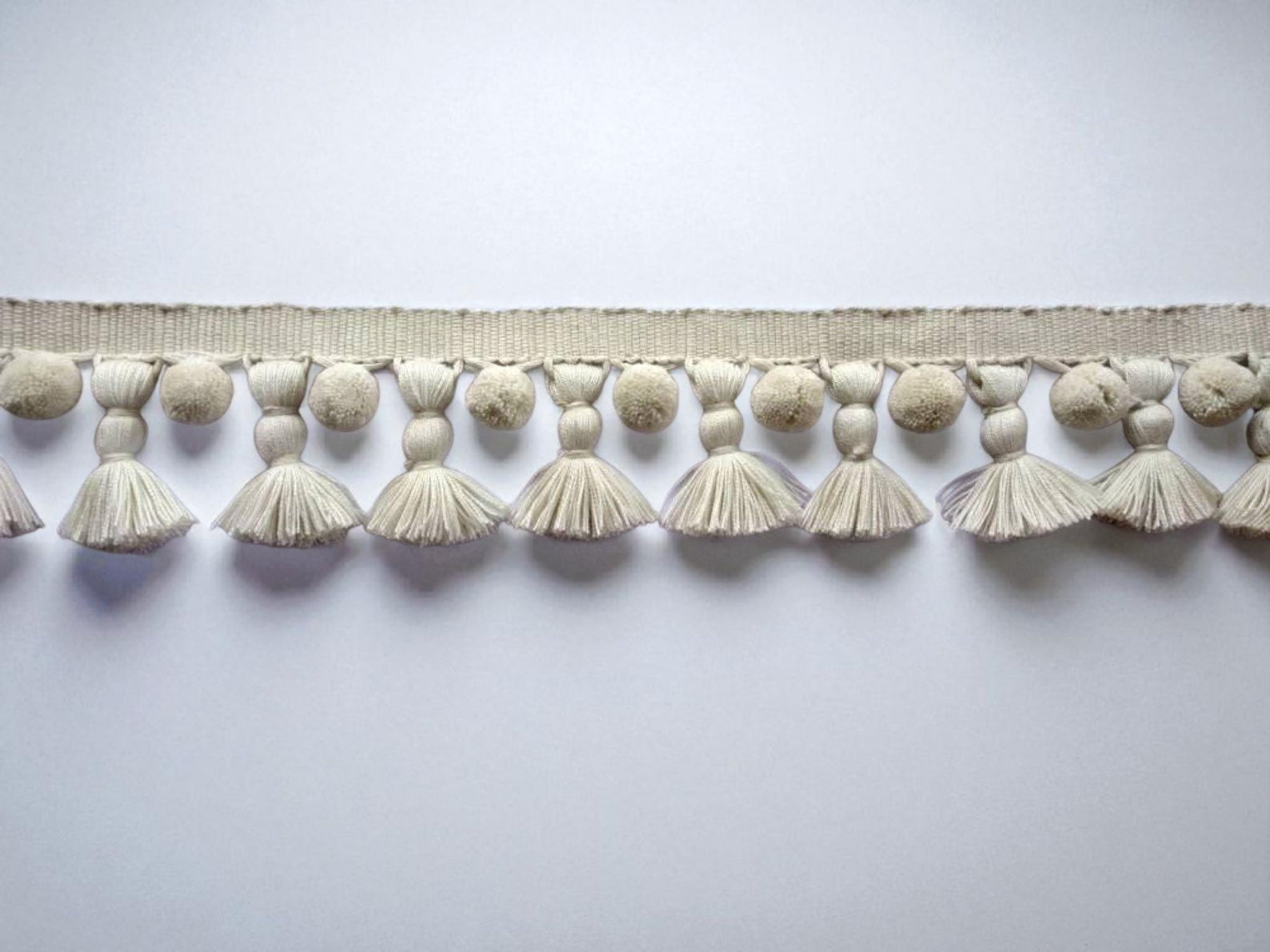 decorative trim UK, pom pom ribbon, pom pom trim UK, tassel trim UK, tassel edging, ivory pom pom tassel trim