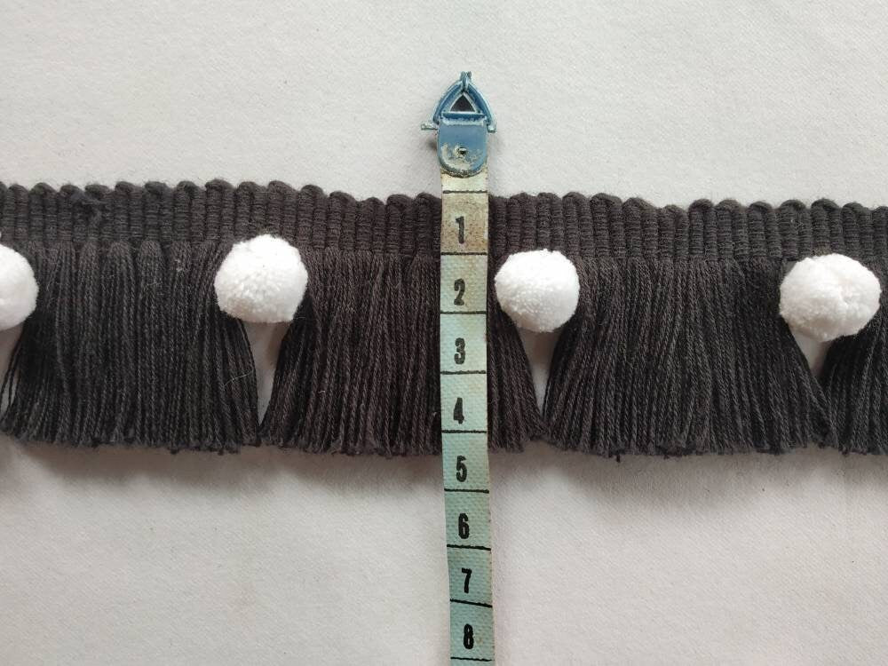 black brush fringe with white pom poms, black trims, black fringes, white pom poms, trimming