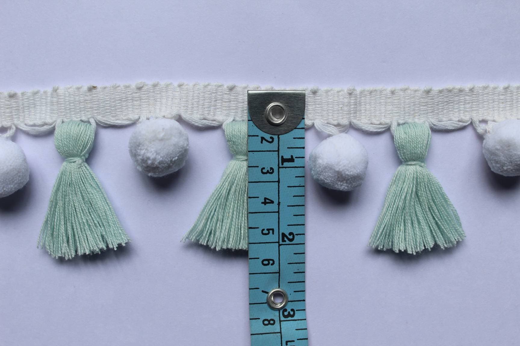 baby blue / white pom pom tassel