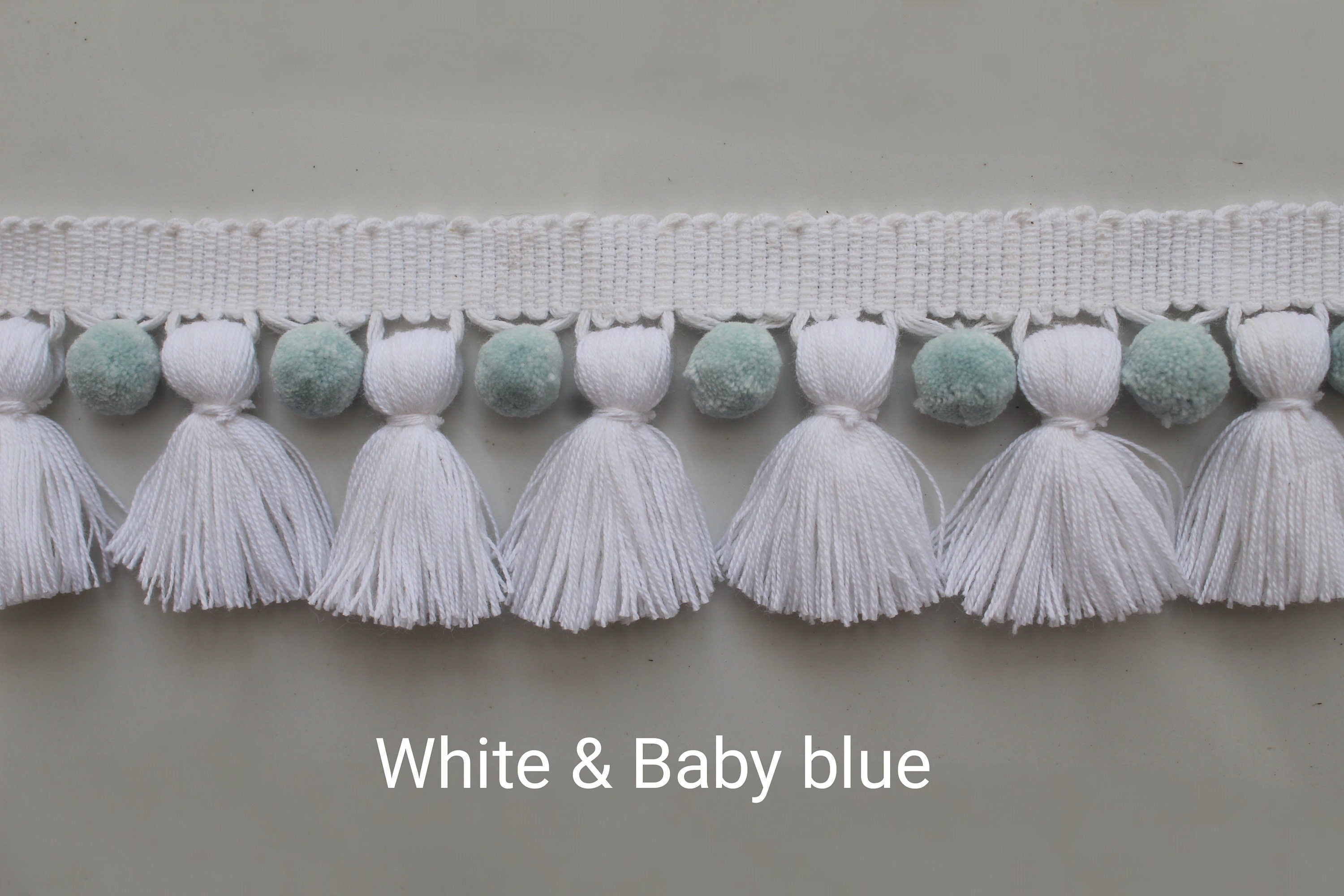 White and baby blue pom pom tassel trim